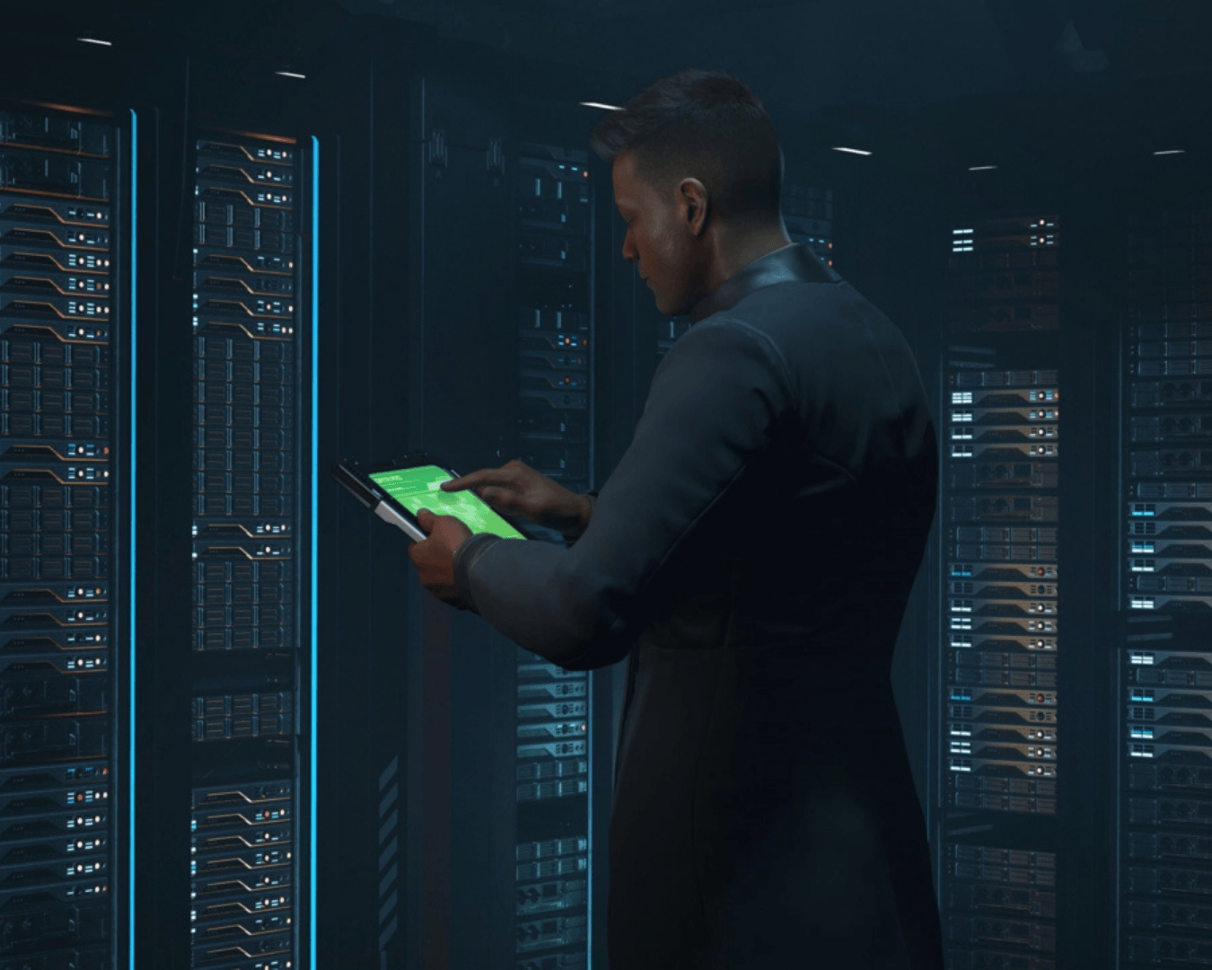 an attendant stands over the server room checking out issues on his tablet